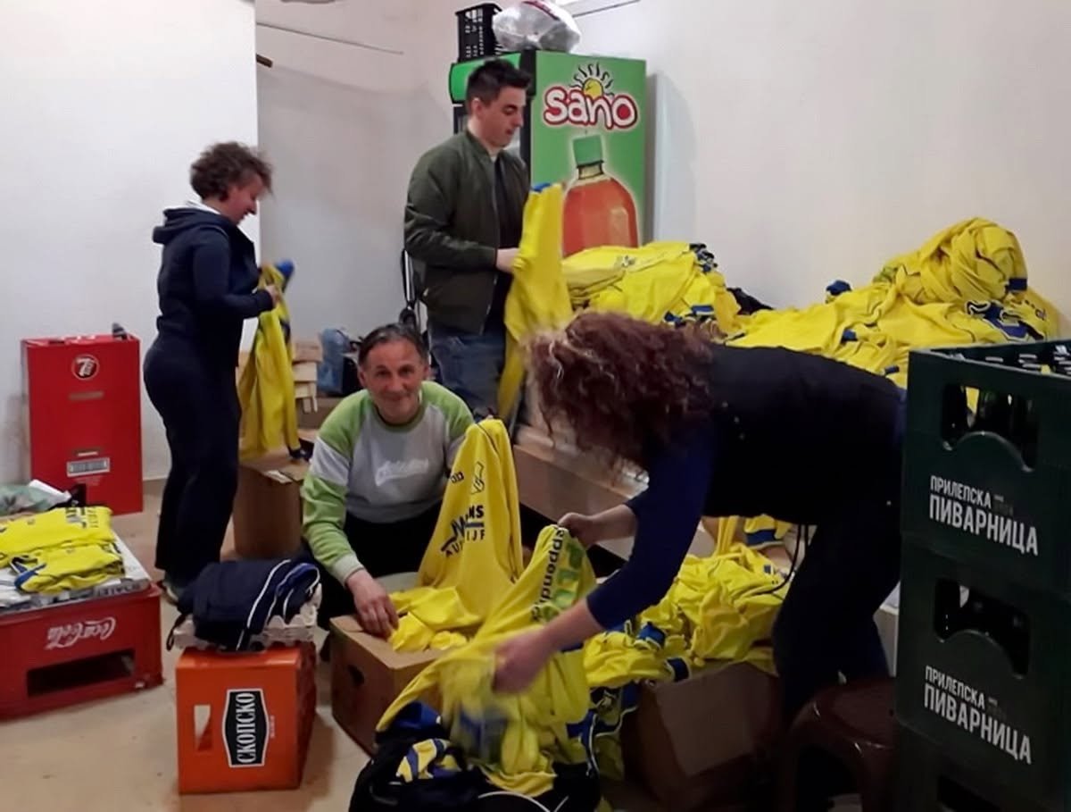 Sorting jerseys for a donation drive